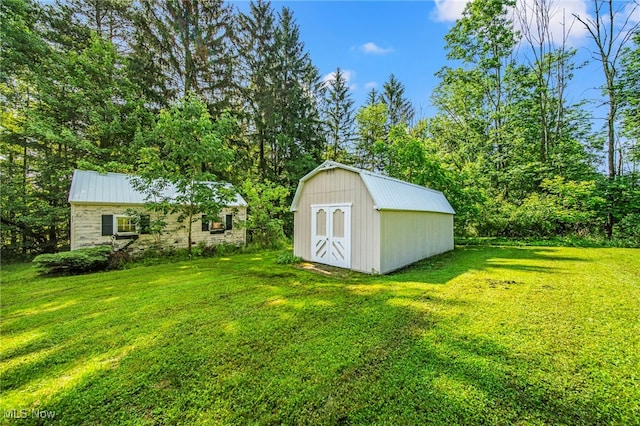 416 N Hambden St, Chardon, OH 44024 - view of green lawn with a storage shed