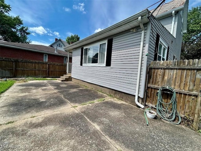623 N 7th St, Marietta, OH 45750 - view of side of property with a patio and entry steps