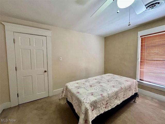 623 N 7th St, Marietta, OH 45750 - bedroom with light colored carpet and a ceiling fan