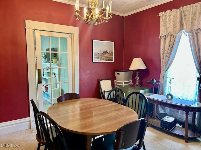 623 N 7th St, Marietta, OH 45750 - carpeted dining space with a chandelier and crown molding