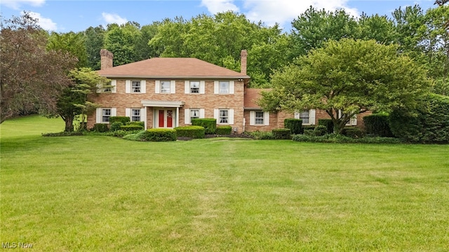 8640 Foxglove Ave NW, Clinton, OH 44216 - view of front of home with a front lawn and a chimney