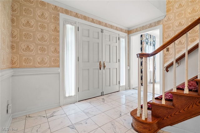 8640 Foxglove Ave NW, Clinton, OH 44216 - foyer with light marble finish flooring, stairway, a wainscoted wall, and wallpapered walls