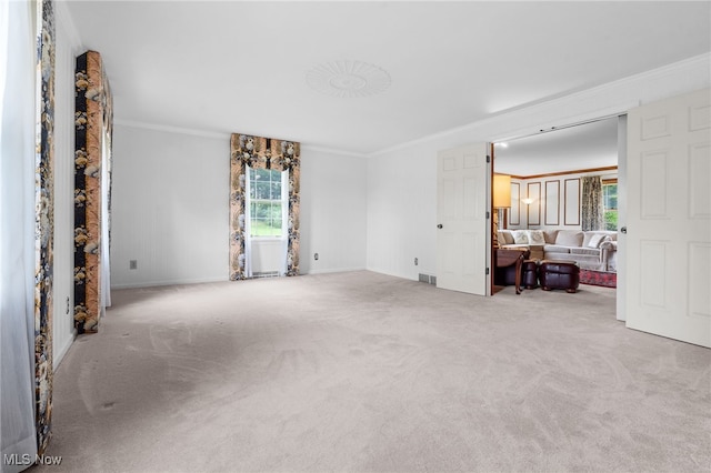 8640 Foxglove Ave NW, Clinton, OH 44216 - living area with carpet floors and ornamental molding