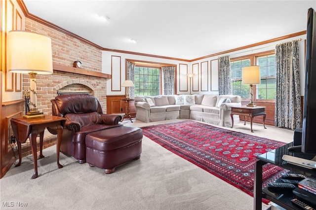 8640 Foxglove Ave NW, Clinton, OH 44216 - living room with crown molding, plenty of natural light, carpet flooring, a brick fireplace, and a decorative wall