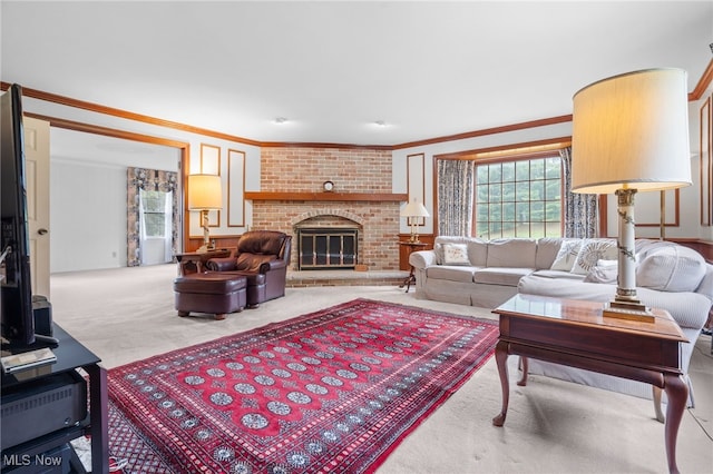 8640 Foxglove Ave NW, Clinton, OH 44216 - carpeted living room featuring healthy amount of natural light, ornamental molding, and a fireplace