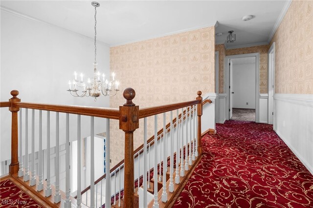 8640 Foxglove Ave NW, Clinton, OH 44216 - corridor featuring an upstairs landing, a chandelier, ornamental molding, carpet, and wallpapered walls