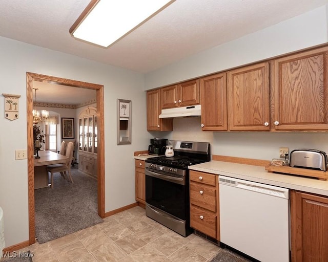 4053 Quail Ct, Ashtabula, OH 44004 - kitchen with white dishwasher, gas stove, under cabinet range hood, and light countertops