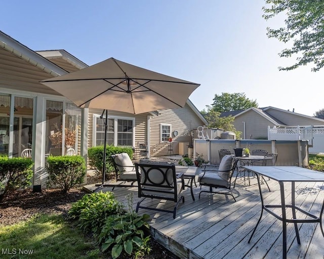 4053 Quail Ct, Ashtabula, OH 44004 - wooden deck with outdoor dining space