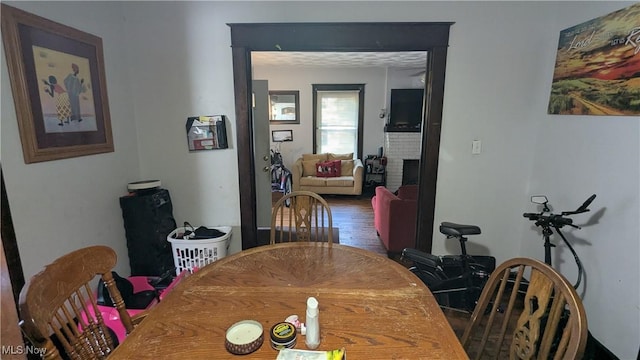 2310 7th St SW, Canton, OH 44706 - dining area with a fireplace and wood finished floors