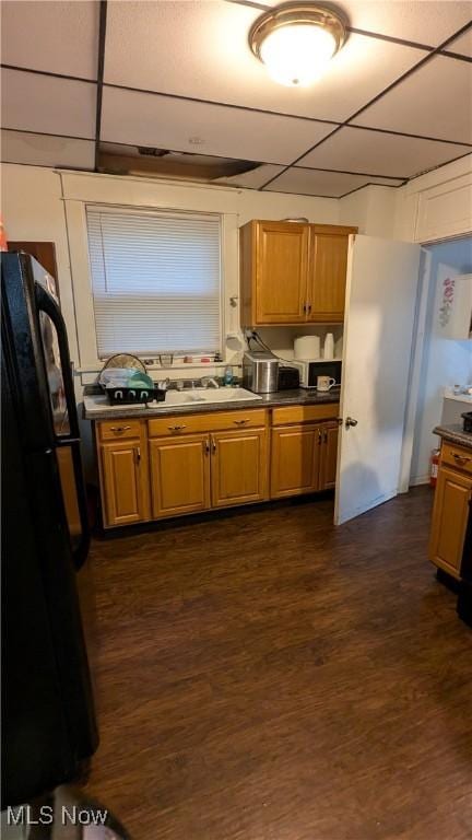 2310 7th St SW, Canton, OH 44706 - kitchen featuring freestanding refrigerator, dark wood-style floors, and dark countertops