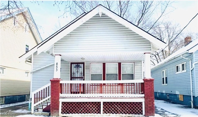 853 E 144th St, Cleveland, OH 44110 - view of front of home featuring covered porch