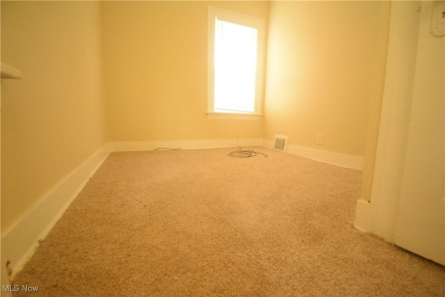 853 E 144th St, Cleveland, OH 44110 - spare room with carpet flooring and baseboards