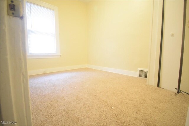 853 E 144th St, Cleveland, OH 44110 - carpeted spare room featuring baseboards