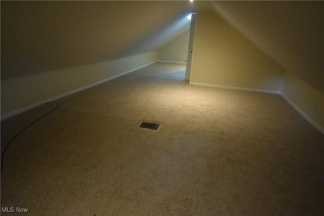 853 E 144th St, Cleveland, OH 44110 - additional living space featuring vaulted ceiling and carpet