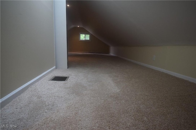 853 E 144th St, Cleveland, OH 44110 - additional living space with lofted ceiling and carpet flooring