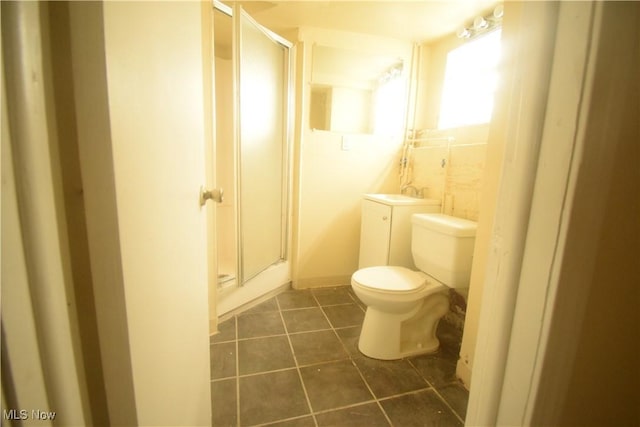 853 E 144th St, Cleveland, OH 44110 - full bathroom featuring vanity, a shower stall, and tile patterned flooring
