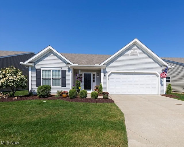 114 Westminster Way, Elyria, OH 44035 - ranch-style home with an attached garage, a front yard, and concrete driveway