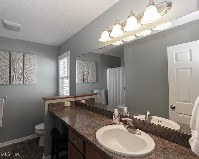 114 Westminster Way, Elyria, OH 44035 - bathroom with vanity, a textured ceiling, and curtained shower