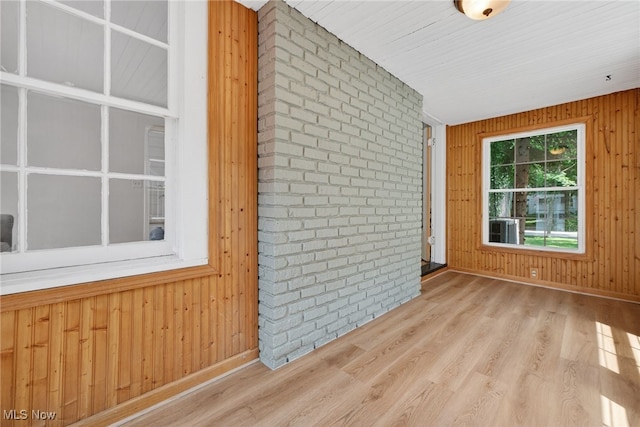 3294 Avalon Rd, Shaker Heights, OH 44120 - spare room featuring wood walls, wood finished floors, and brick wall