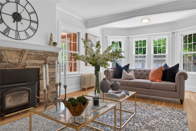 3294 Avalon Rd, Shaker Heights, OH 44120 - living room featuring healthy amount of natural light, radiator heating unit, wood finished floors, and crown molding