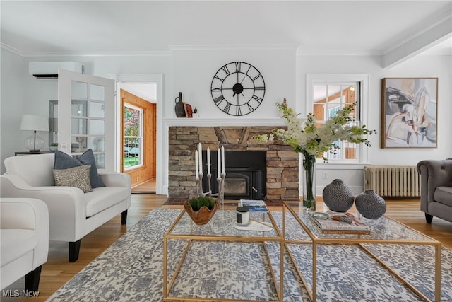 3294 Avalon Rd, Shaker Heights, OH 44120 - living area featuring radiator, an AC wall unit, plenty of natural light, crown molding, and wood finished floors