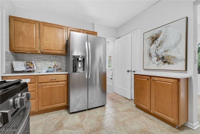 3294 Avalon Rd, Shaker Heights, OH 44120 - kitchen with stainless steel appliances, light countertops, tasteful backsplash, and brown cabinets