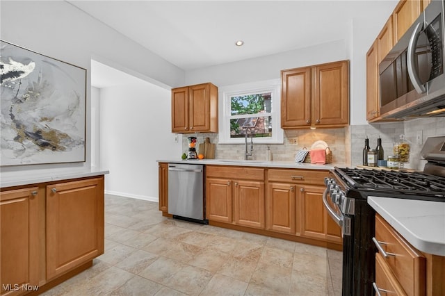 3294 Avalon Rd, Shaker Heights, OH 44120 - kitchen with stainless steel appliances, decorative backsplash, light countertops, and brown cabinets