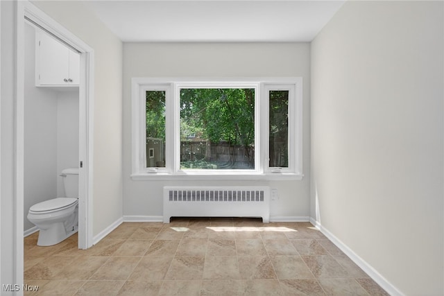 3294 Avalon Rd, Shaker Heights, OH 44120 - unfurnished bedroom with radiator heating unit and stone finish flooring