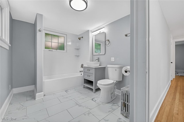 3294 Avalon Rd, Shaker Heights, OH 44120 - bathroom featuring marble finish floors, vanity, shower / bath combination, and radiator