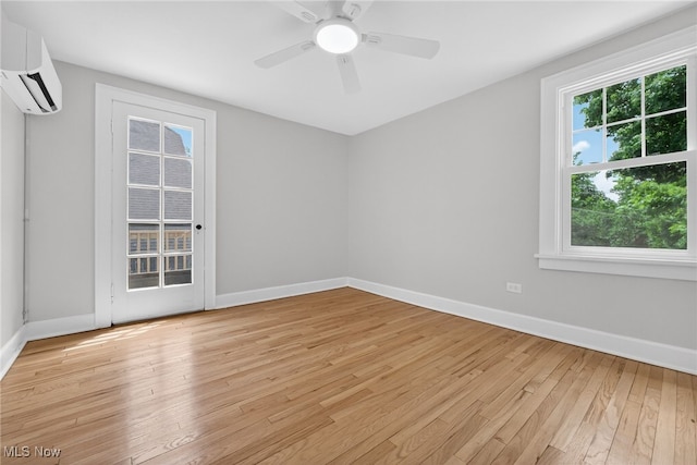 3294 Avalon Rd, Shaker Heights, OH 44120 - empty room with a wall mounted air conditioner, light wood finished floors, and a ceiling fan