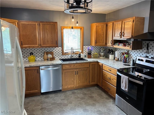 629 E 5th St, Salem, OH 44460 - kitchen featuring stainless steel appliances, wall chimney range hood, tasteful backsplash, brown cabinetry, and light stone countertops