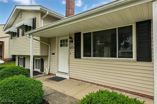 6633 Tamarind Dr, Bedford Heights, OH 44146 - doorway to property featuring a chimney