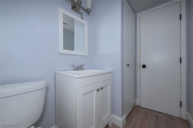 6633 Tamarind Dr, Bedford Heights, OH 44146 - half bathroom featuring wood finished floors and vanity