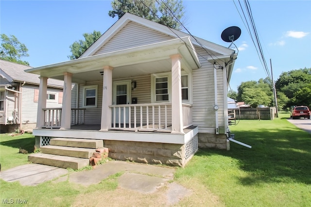 874 Cleveland Ave, Amherst, OH 44001 - view of front of house featuring covered porch and a front lawn