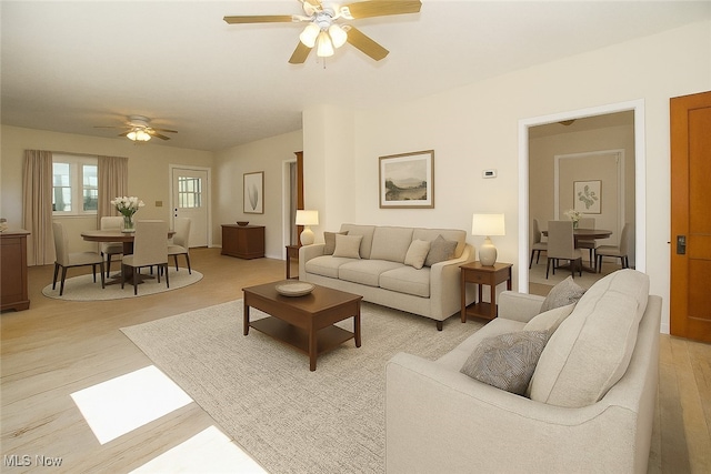 874 Cleveland Ave, Amherst, OH 44001 - living room featuring a ceiling fan and light wood finished floors