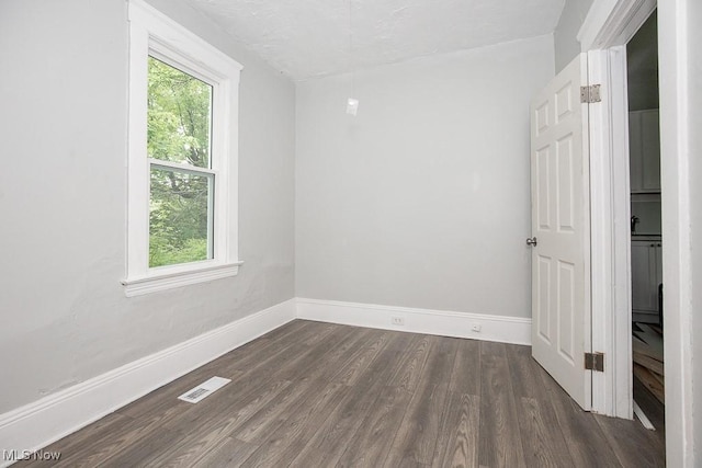 8023 Kosciuszko Ave, Cleveland, OH 44103 - unfurnished room featuring dark wood-style flooring and baseboards