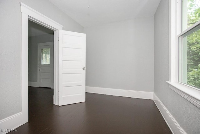 8023 Kosciuszko Ave, Cleveland, OH 44103 - spare room with dark wood-type flooring and baseboards