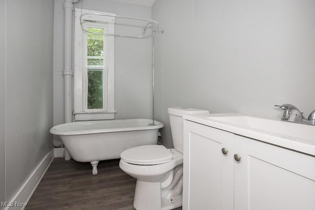 8023 Kosciuszko Ave, Cleveland, OH 44103 - bathroom featuring a soaking tub, vanity, and wood finished floors