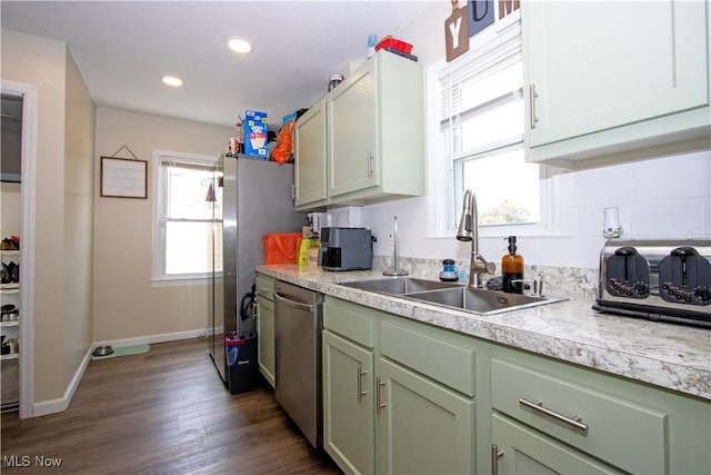 1058 Greenwood Ave, Akron, OH 44320 - kitchen featuring stainless steel dishwasher, green cabinets, light countertops, dark wood-style floors, and recessed lighting