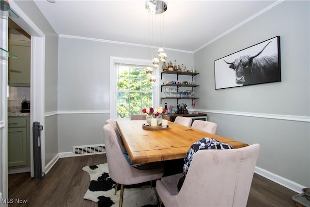 1058 Greenwood Ave, Akron, OH 44320 - dining room featuring dark wood-type flooring and ornamental molding