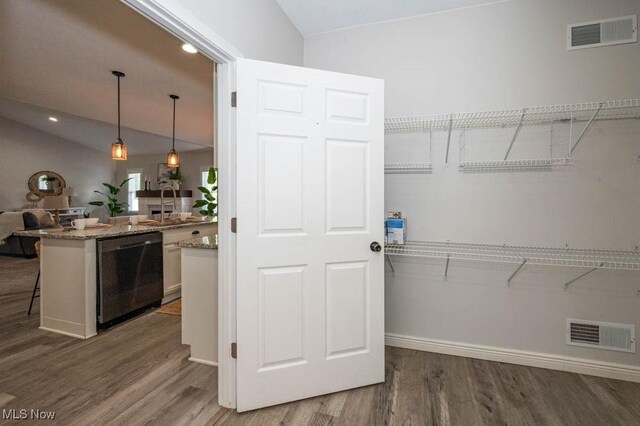2692 Aspen Dr, Girard, OH 44420 - walk in closet featuring lofted ceiling and wood finished floors