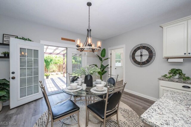 2692 Aspen Dr, Girard, OH 44420 - dining space with a chandelier, dark wood-style flooring, and healthy amount of natural light
