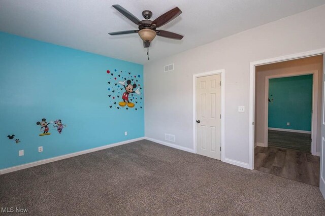 2692 Aspen Dr, Girard, OH 44420 - unfurnished bedroom featuring dark colored carpet and a ceiling fan