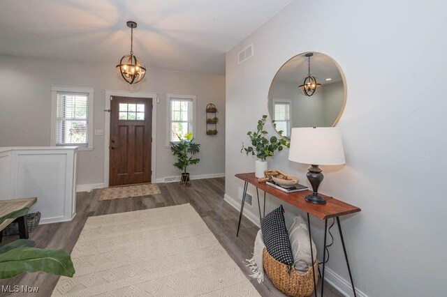 2692 Aspen Dr, Girard, OH 44420 - foyer entrance with a chandelier, wood finished floors, and healthy amount of natural light