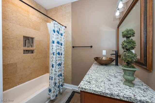 2692 Aspen Dr, Girard, OH 44420 - bathroom featuring vanity, shower / bath combo, and wood finished floors