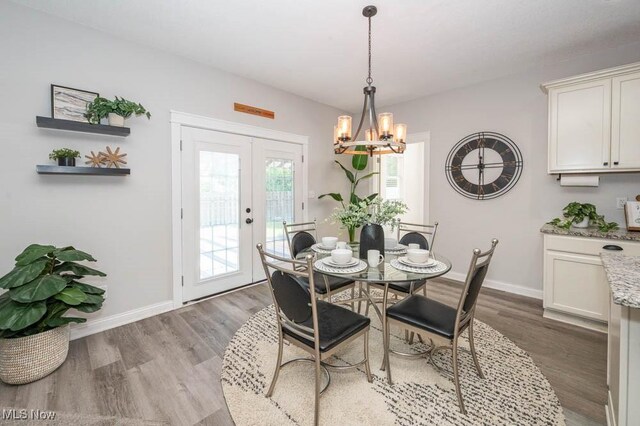 2692 Aspen Dr, Girard, OH 44420 - dining room featuring french doors, a chandelier, and wood finished floors