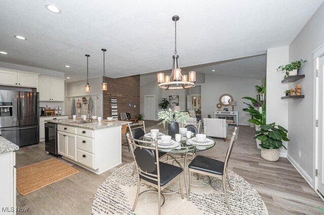 2692 Aspen Dr, Girard, OH 44420 - dining area with light wood-type flooring, recessed lighting, and a chandelier