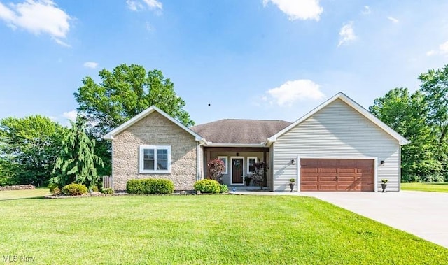 2692 Aspen Dr, Girard, OH 44420 - view of front of property with an attached garage, a front yard, driveway, and stone siding