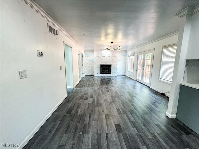 5123 Glenbrook Dr, Vienna, WV 26105 - unfurnished living room with ornamental molding, dark wood-type flooring, a fireplace, and a chandelier