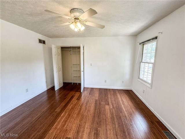 5123 Glenbrook Dr, Vienna, WV 26105 - unfurnished bedroom with wood finished floors, a textured ceiling, a ceiling fan, and a closet